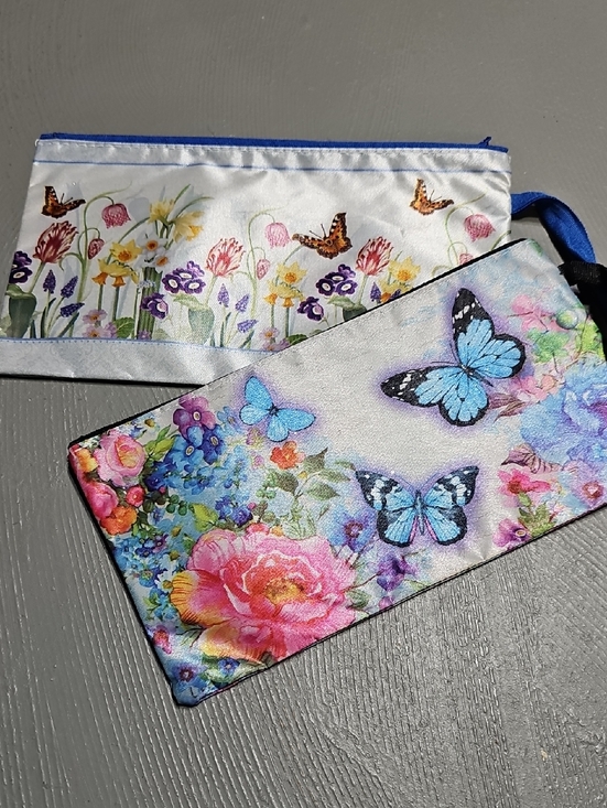 Handbags - Floral and Butterfly Print Zipper Wristlet Pouches Set Of Two NWOT